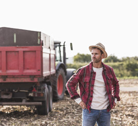 Farmer standing on field - UUF11929