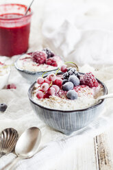 Bowl of natural yoghurt with raspberry sauce and frozen fruits - SBDF03326