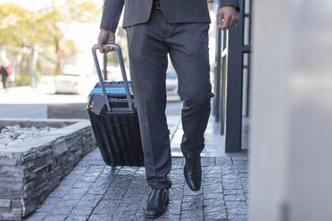 Businessman walking with luggage - ZEF14644