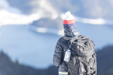 Germany, Bavaria, Alps, hiker with backpack at Lake Walchen - MMAF00149