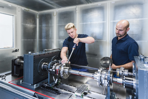 Two colleagues working in modern factory stock photo