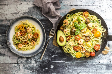 Plate and frying pan of spaghetti with zoodles, guacamole, tomatoes and shrimps - SARF03384