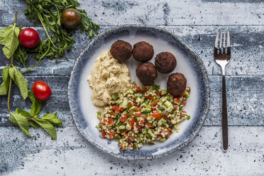 Bulgur wheat salad, Hummus and Falafel on plate - SARF03390