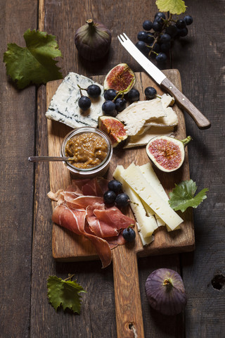 Cheese platter with fruits and fig mustard stock photo