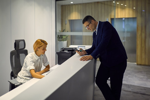 Businessman at office reception stock photo