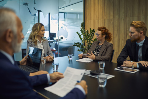 Group of business people discussing in meeting stock photo