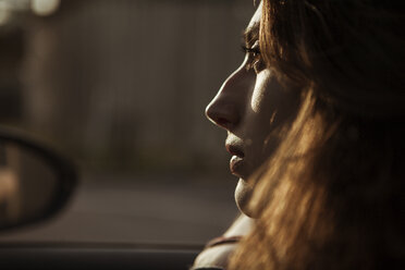 Serious young woman in car - FEXF00308