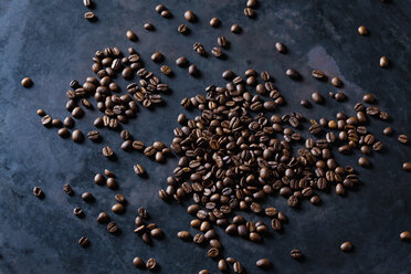 Freshly roasted coffee beans on dark background - CSF28412