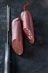 Fresh blood sausage on dark background - CSF28443