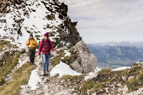 Germany, Bavaria, Oberstdorf, two hikers walking in alpine scenery stock photo