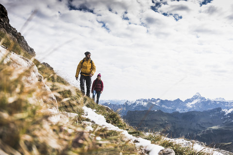 Germany, Bavaria, Oberstdorf, two hikers walking in alpine scenery stock photo