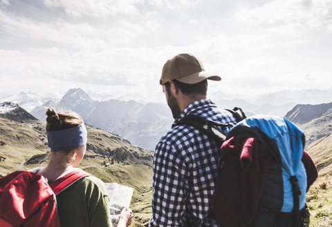 Germany, Bavaria, Oberstdorf, two hikers with map in alpine scenery stock photo