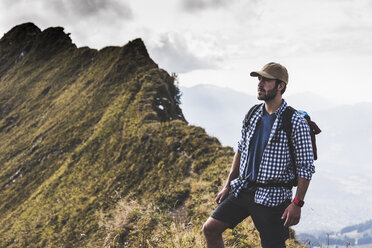 Germany, Bavaria, Oberstdorf, hiker standing on mountain ridge - UUF12189