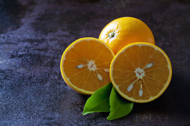 Organic oranges in halves on dark background - CSF28473