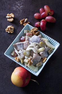 Matjes herring with apples and onions in a bowl - CSF28474