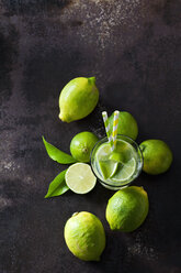 Organic green limes on dark background - CSF28481