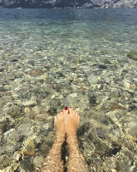 Italy, Brenzone sul Garda, Lake Garda, woman in water - LVF06369