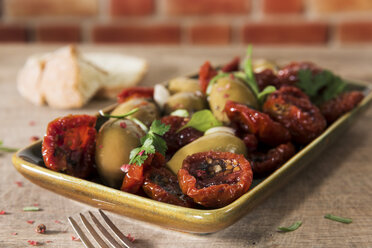 Antipasti, pickled olives and tried tomato, parsley, rosemary, red pepper and olive bread - CSTF01457