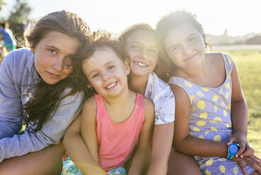 Group picture of four girls head to head at backlight - MGOF03662