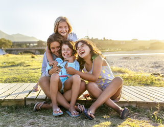 Group picture of four girls on boardwalk having fun - MGOF03670