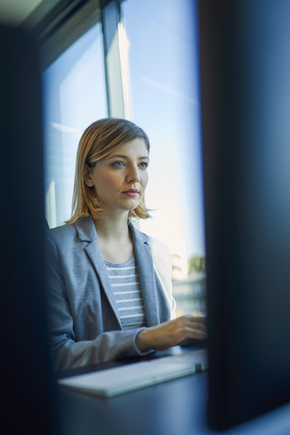 Businesswoman using computer in office stock photo