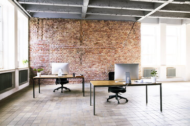 Coworking space with brick wall in office - HAPF02333