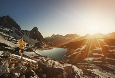 Germany, Allgaeu Alps, man running in mountains - MALF00013