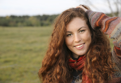 Portrait of redheaded young woman in autumn stock photo