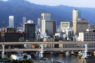 Japan, Kobe, High-rise buildings at seaport - THAF02053