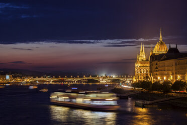 Hungary, Budapest, city by night, lights of passenger tour boat and Margaret Bridge on Danube River - ABOF00332