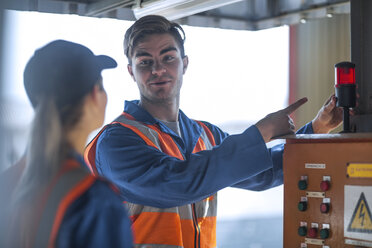 Two workers wearing overalls and reflective jackets - ZEF14675