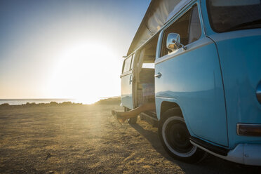 Spain, Tenerife, van parked at seaside at sunset - SIPF01862