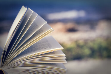 Opened book on the beach - CMF00751