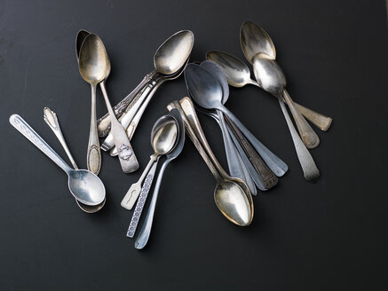 Heap of various silver and golden spoons - PPXF00131