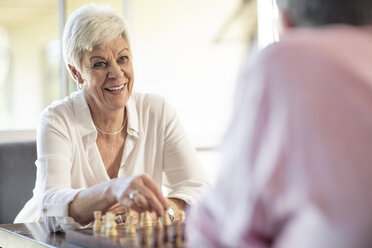 Senior couple playing chess at home - ZEF14755