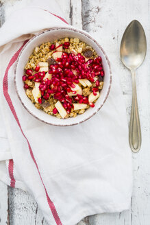 Bowl of fruit muesli with dried cranberries, apple and pomegranate seed - LVF06412