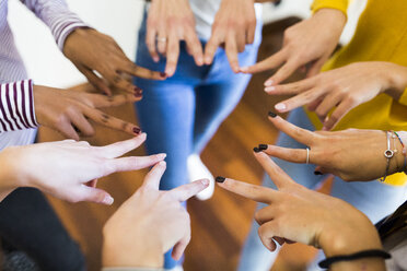 Close-up of hands of five women - GIOF03420