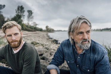 Father and son meeting at Rhine river in autmn, talking together - KNSF02899