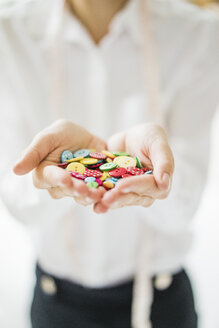 Assortment of buttons in woman's hands - JOSF01991