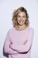 Portrait of blond woman, smiling, rosa pullover - PNEF00357