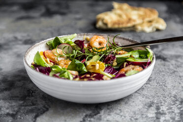 Lamb's lettuce, radicchio, shrimp, red radish, orange, pine nut, rosemary, avocado in bowl - SARF03420