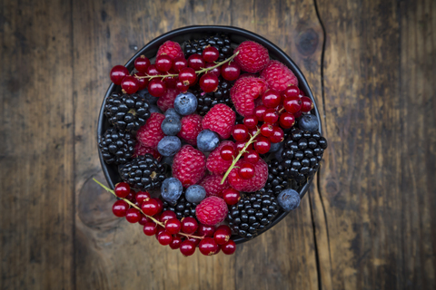 Wild berries in bowl stock photo