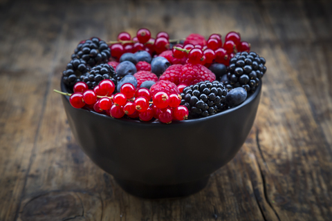 Wild berries in bowl stock photo