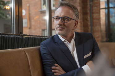 Portrait of businessman waiting in a restaurant - SUF00354