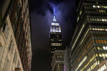 USA, New York, High-rise buildings and Empire State Building at night - HLF01068