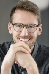 Portrait of smiling young man with glasses - PESF00789