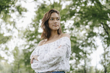 Portrait of young woman in a park - KNSF03122