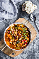 Vegetable chili with kidney bean, sweet potatoe, champignon, corn, snow pea, baguette in bowl - SARF03440