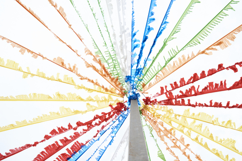 Colorful pennants hanging on flagpole stock photo