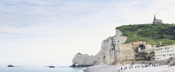 France, Upper Normandy, Seine-Maritime, Etretat, panoramic view of cliff Falaise d’Amont and church Notre Dame de la Garde - DWIF00893